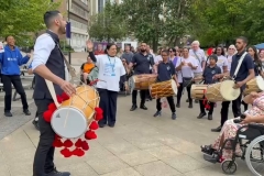 Dhol players performing to the crowd