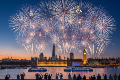 An AI generated image of a fireworks display with two wheelchair symbols over London, showing Big Ben. A crowd of people disabled and non-disabled watching from a distance as they welcome the  start of the New Year